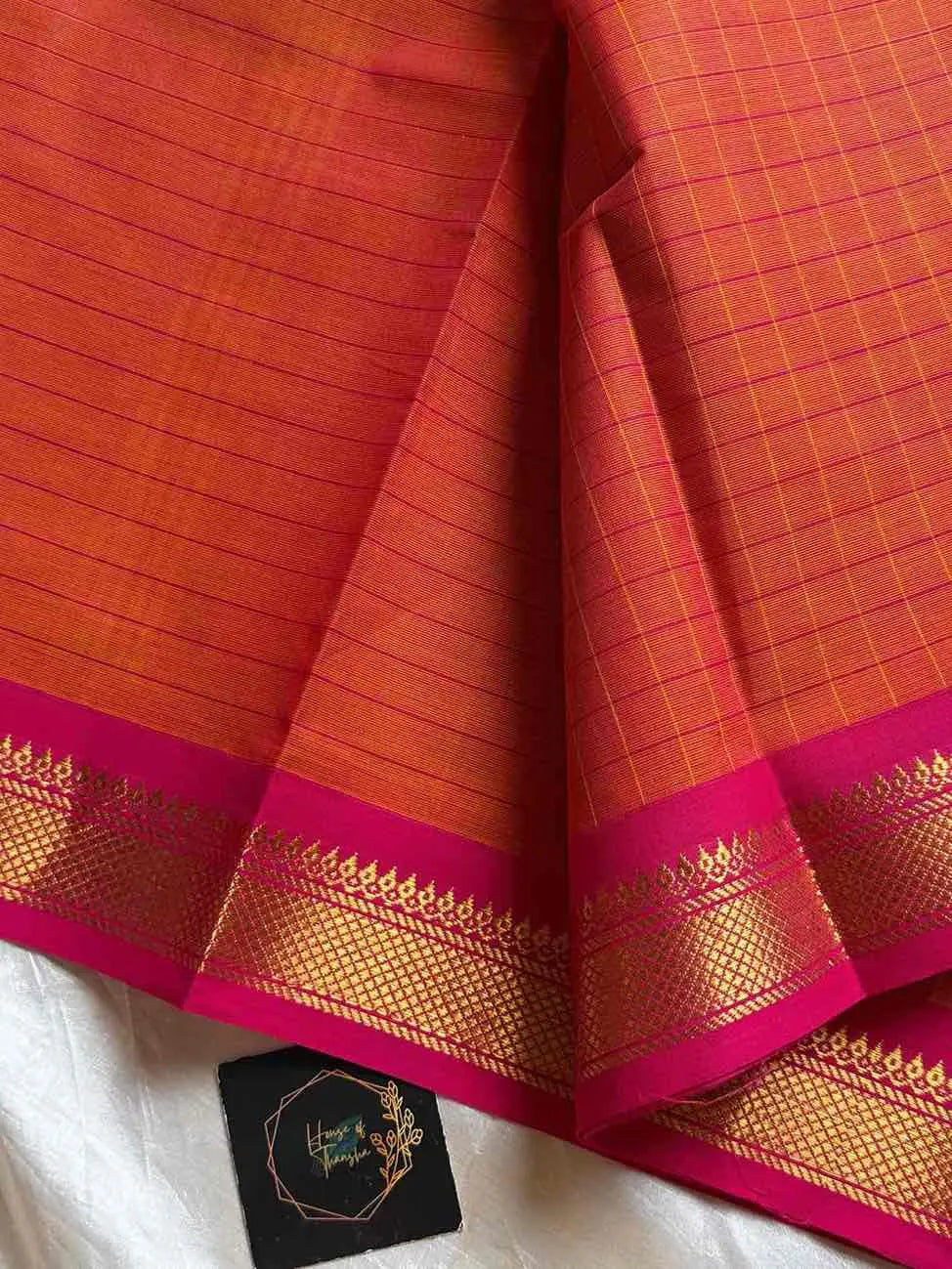 Kattam series - Orange Kanchi cotton checked saree with contrast border.